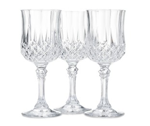 Photo of Three empty clean glasses isolated on white