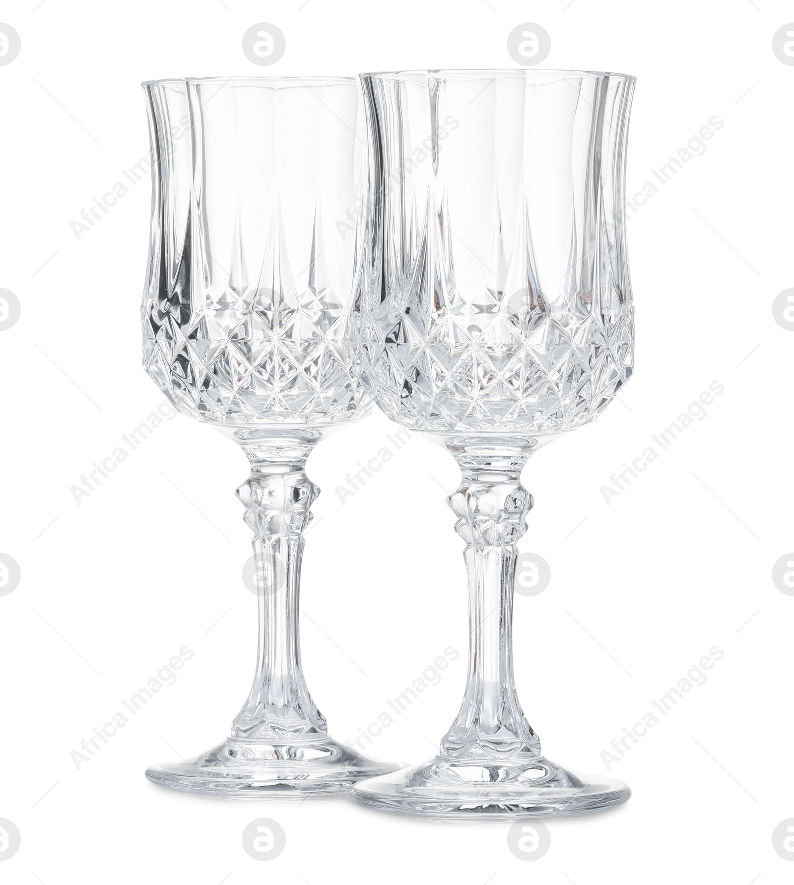 Photo of Two empty clean glasses isolated on white