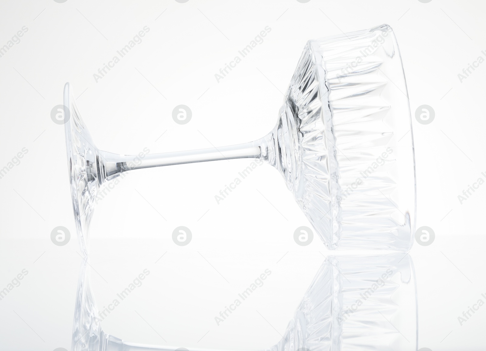 Photo of One empty clean glass isolated on white