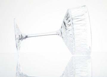 Photo of One empty clean glass isolated on white