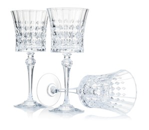 Photo of Three empty clean glasses isolated on white