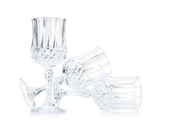 Photo of Three empty clean glasses isolated on white