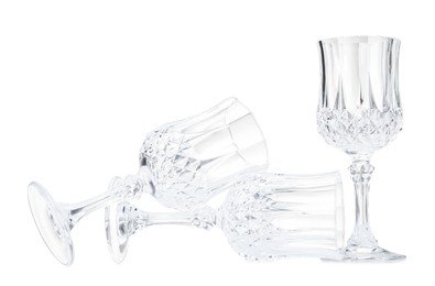 Photo of Three empty clean glasses isolated on white