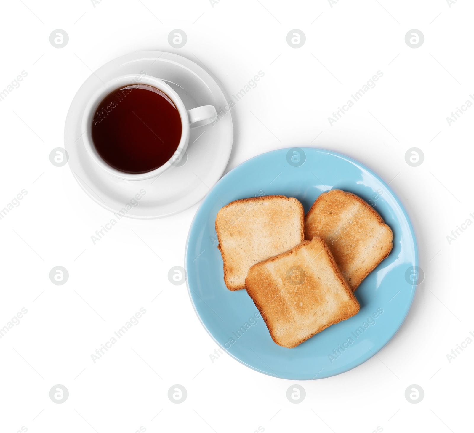 Tasty toast bread and tea isolated on white, top view Photo of Tasty toast bread and tea isolated on white, top view