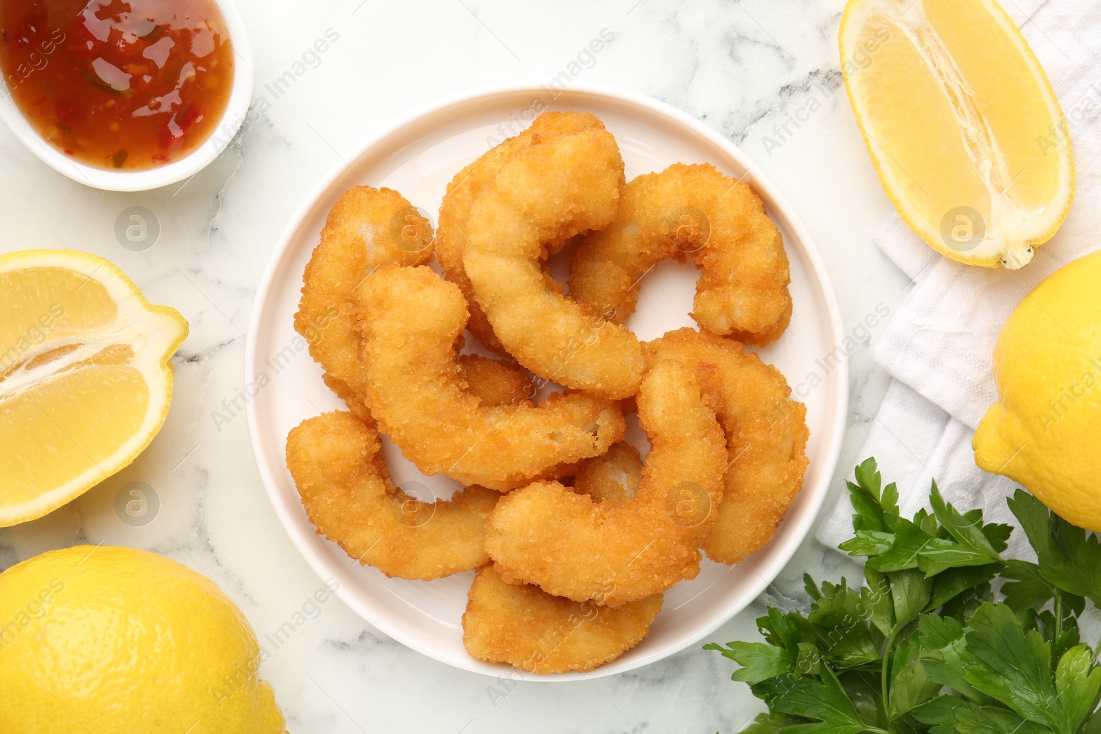 Tasty tempura shrimps served on white marble table, flat lay Photo of Tasty tempura shrimps served on white marble table, flat lay
