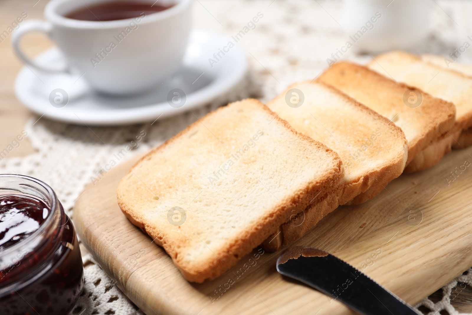 Slices of tasty toasted bread and jam on table, closeup Photo of Slices of tasty toasted bread and jam on table, closeup