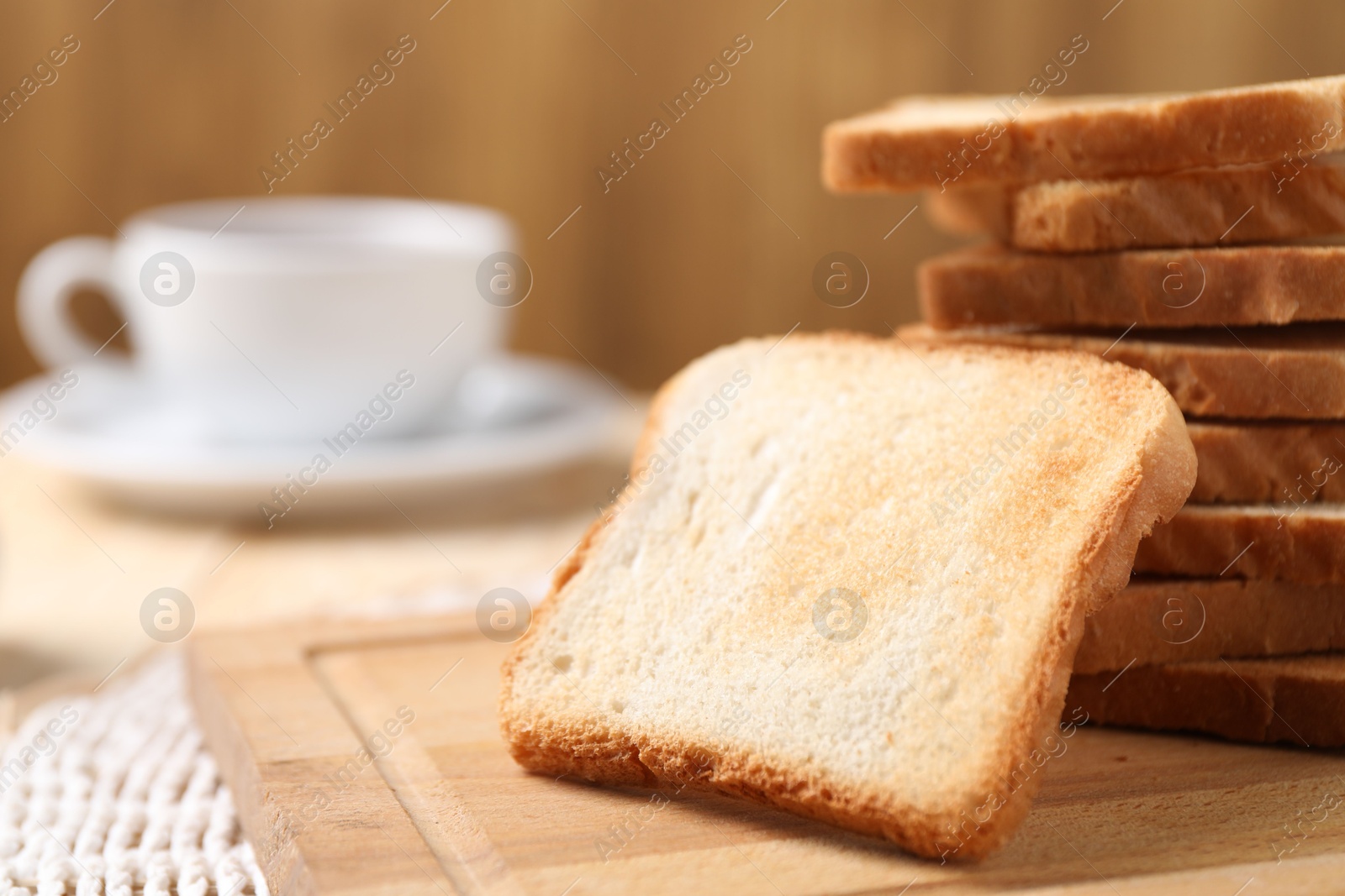 Slices of tasty toasted bread on table, closeup. Space for text Photo of Slices of tasty toasted bread on table, closeup. Space for text