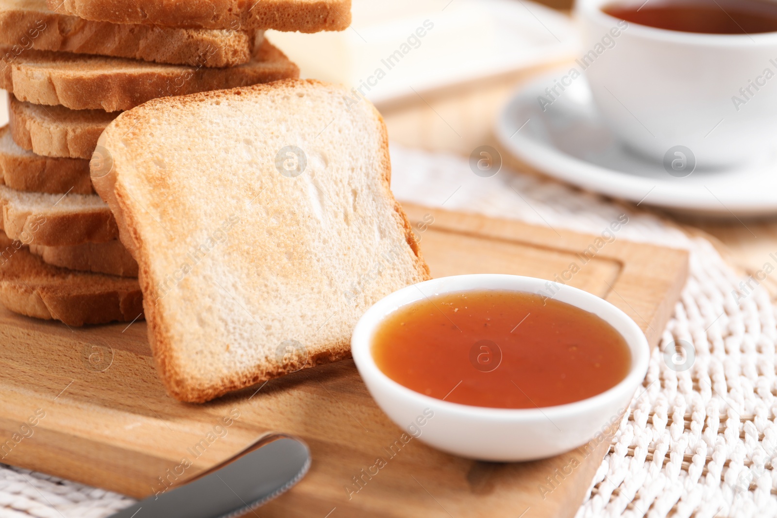 Slices of tasty toasted bread and jam on table, closeup Photo of Slices of tasty toasted bread and jam on table, closeup