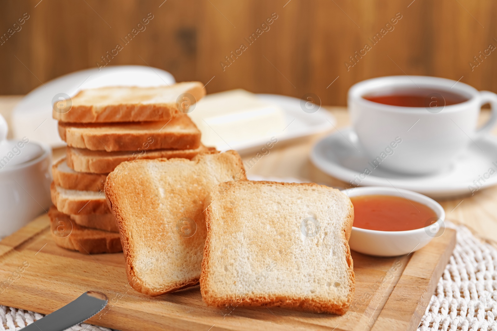 Slices of tasty toasted bread and jam on table, closeup Photo of Slices of tasty toasted bread and jam on table, closeup