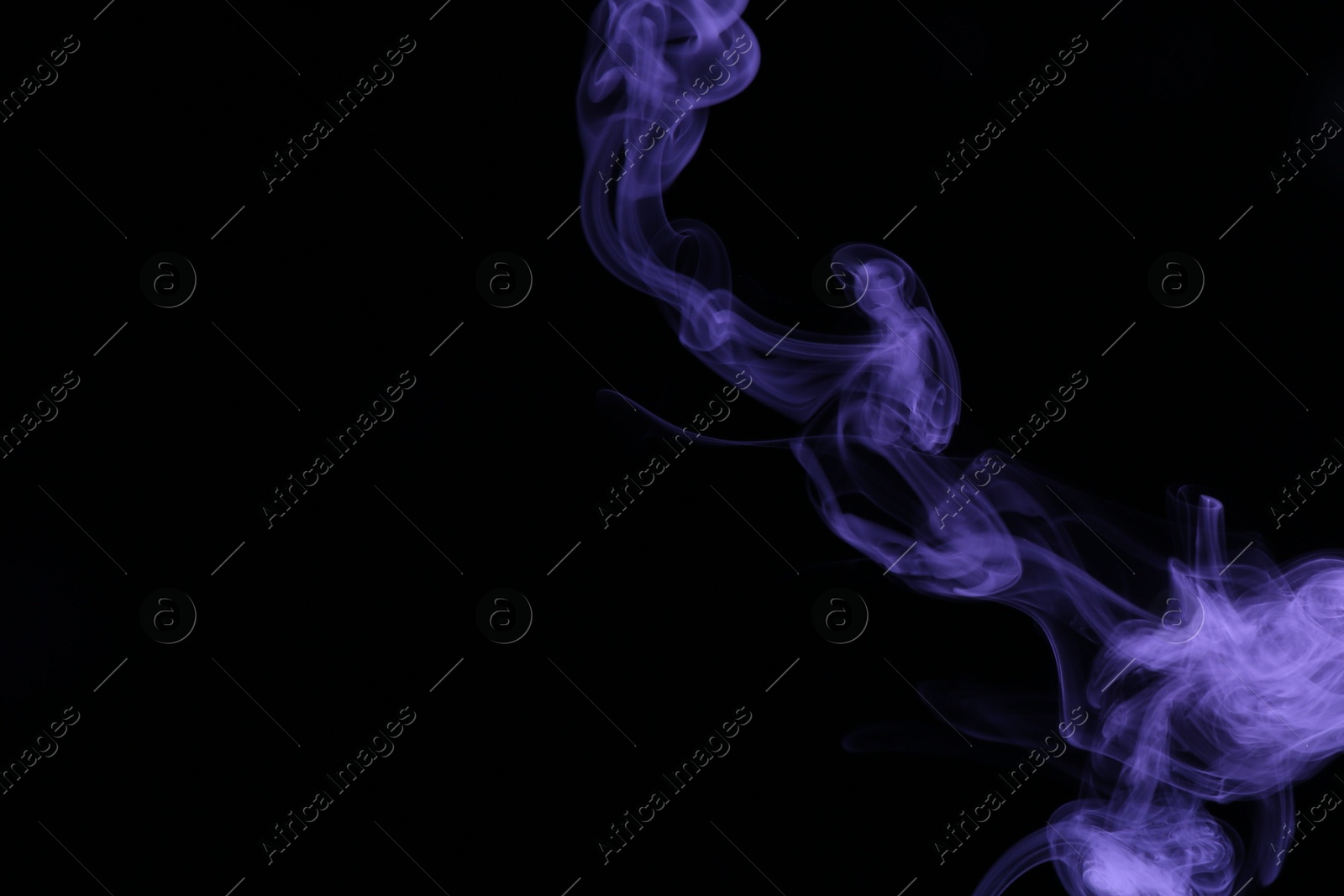 Beautiful smoke in purple light on dark background, space for text Photo of Beautiful smoke in purple light on dark background, space for text