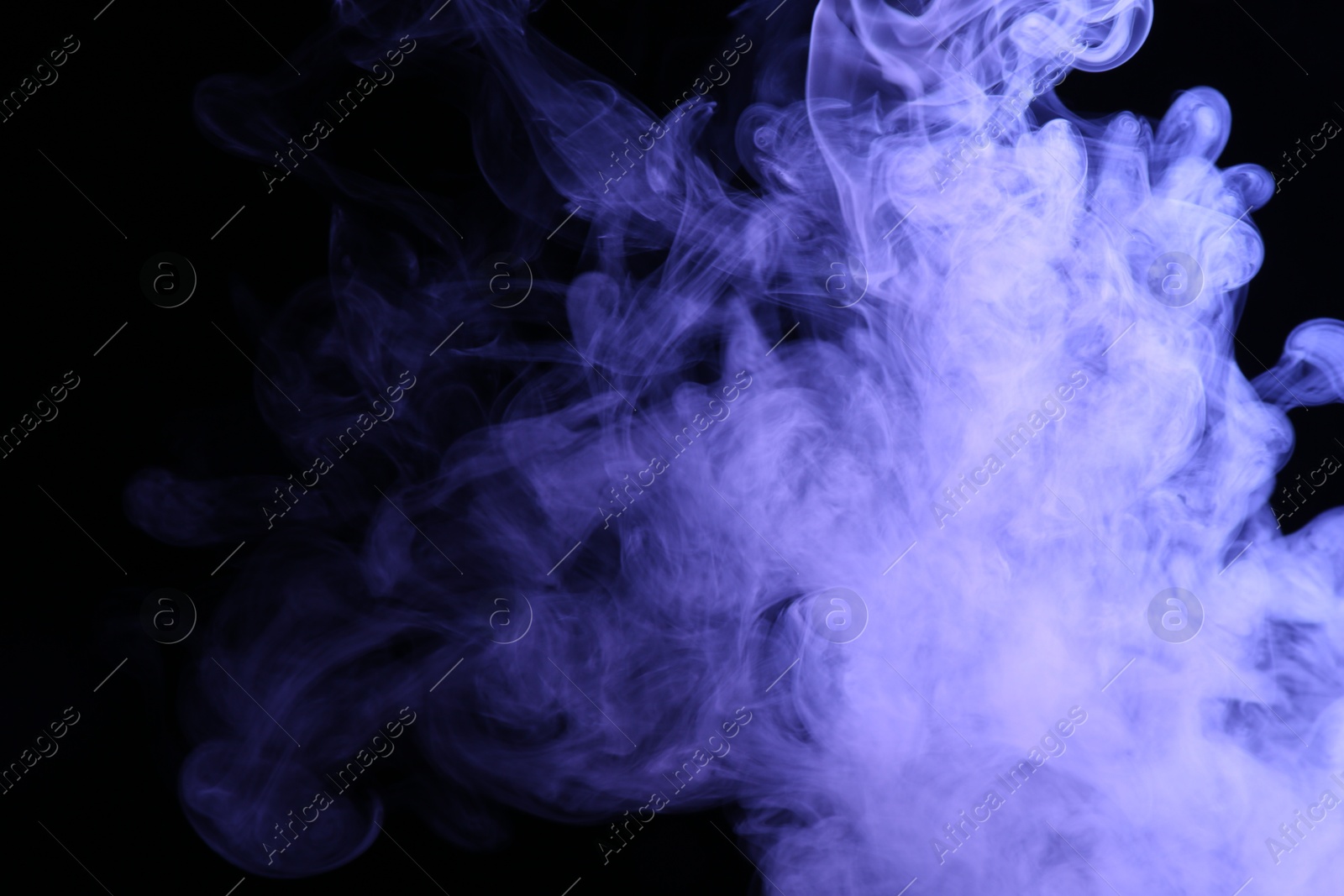 Beautiful smoke in purple light on dark background, space for text Photo of Beautiful smoke in purple light on dark background, space for text