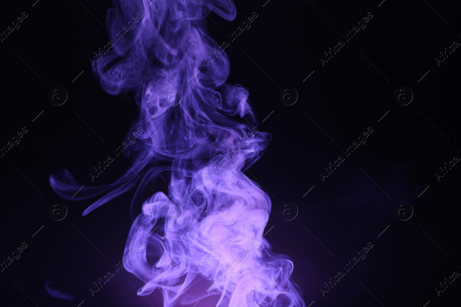 Beautiful smoke in purple light on dark background, space for text Photo of Beautiful smoke in purple light on dark background, space for text