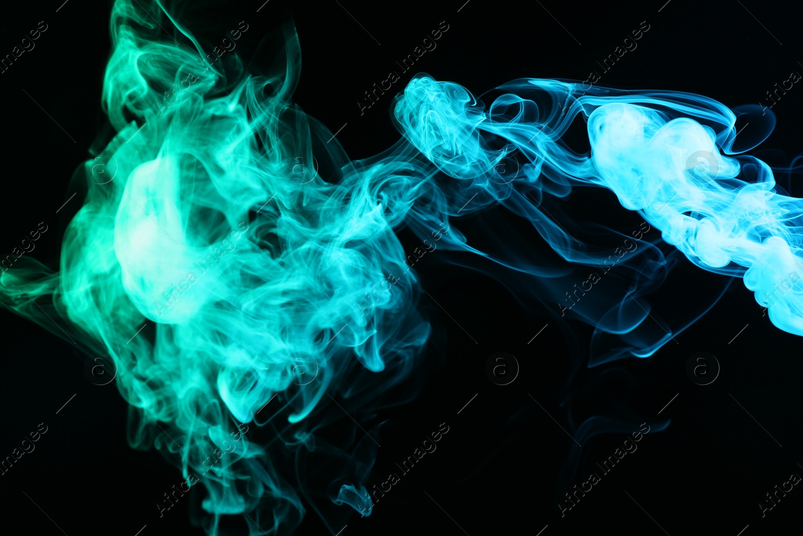 Photo of Beautiful smoke in neon lights on dark background