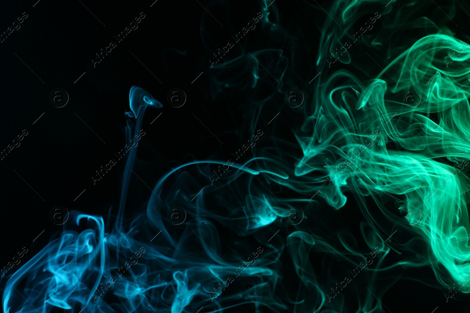 Beautiful smoke in neon lights on dark background Photo of Beautiful smoke in neon lights on dark background