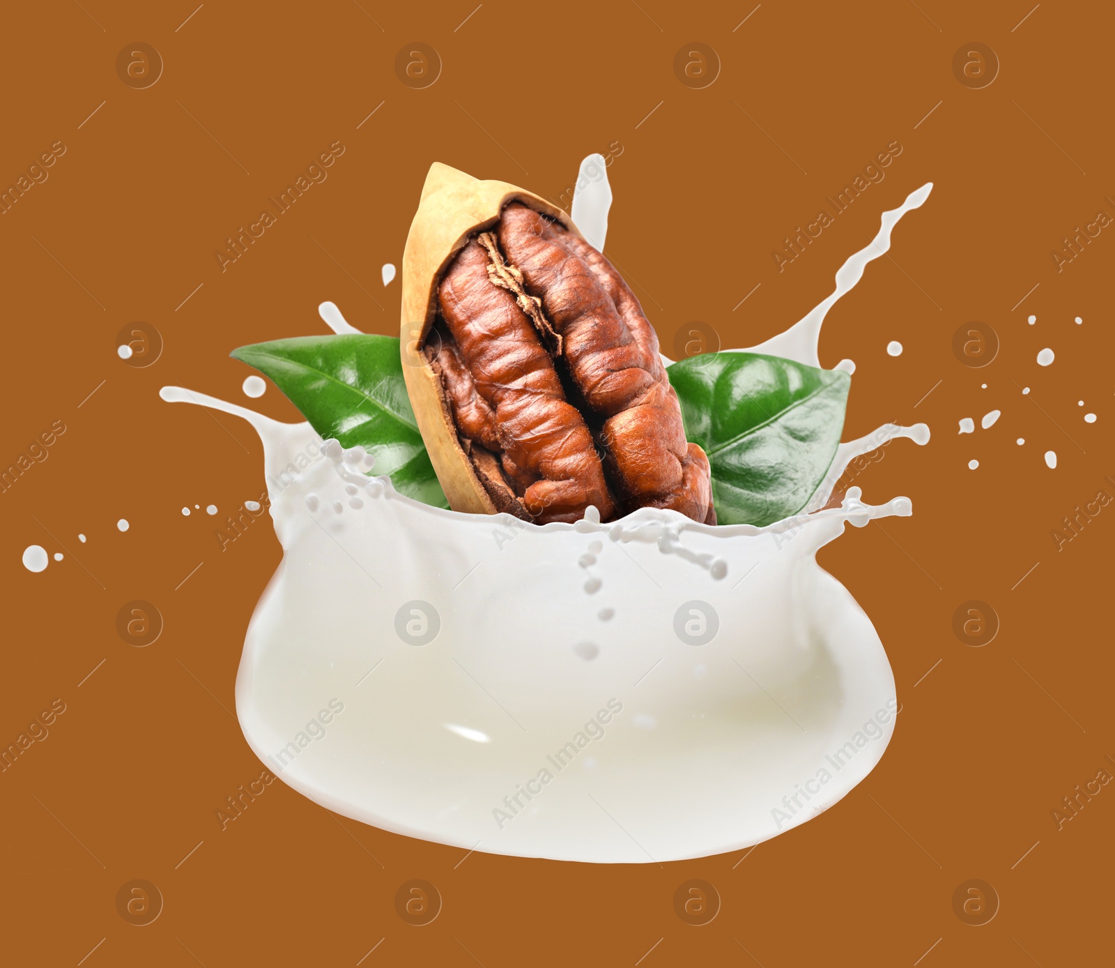 Nut milk splash with pecan and green leaves on brown background Image of Nut milk splash with pecan and green leaves on brown background