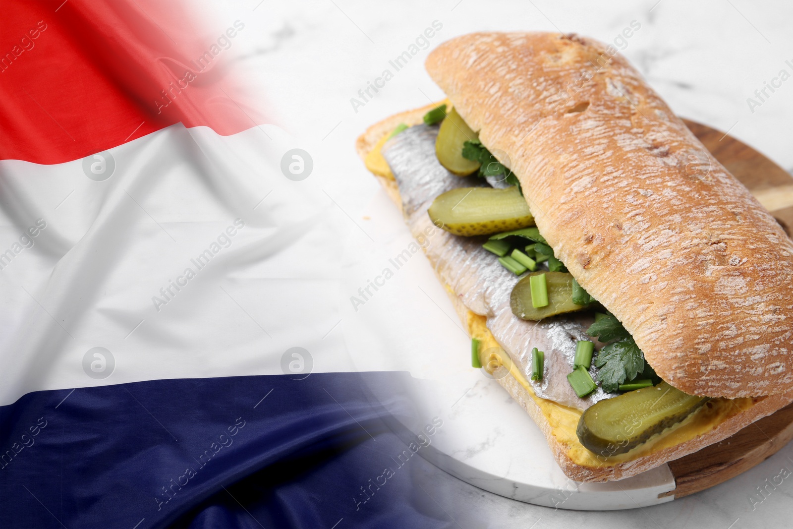 Tasty sandwich with herring and pickles on white marble table and flag of Netherlands Image of Tasty sandwich with herring and pickles on white marble table and flag of Netherlands
