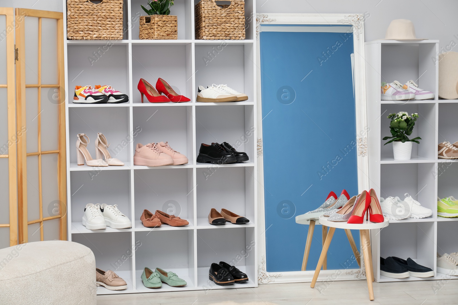Shoe storage. Shelving unit with many different pairs of footwear indoors Photo of Shoe storage. Shelving unit with many different pairs of footwear indoors