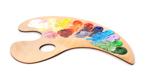 Photo of Wooden palette with paints isolated on white