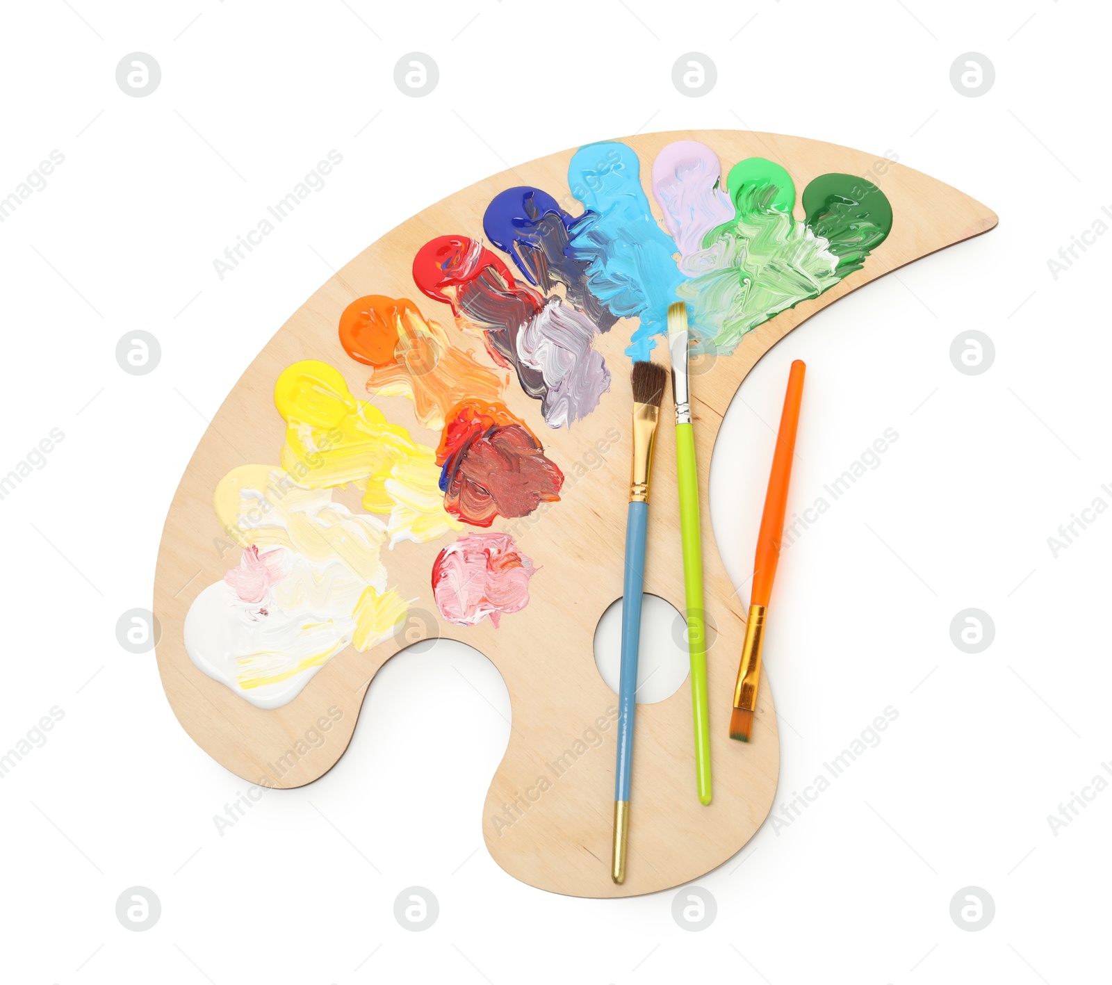 Photo of Wooden palette with paints and brushes isolated on white, top view