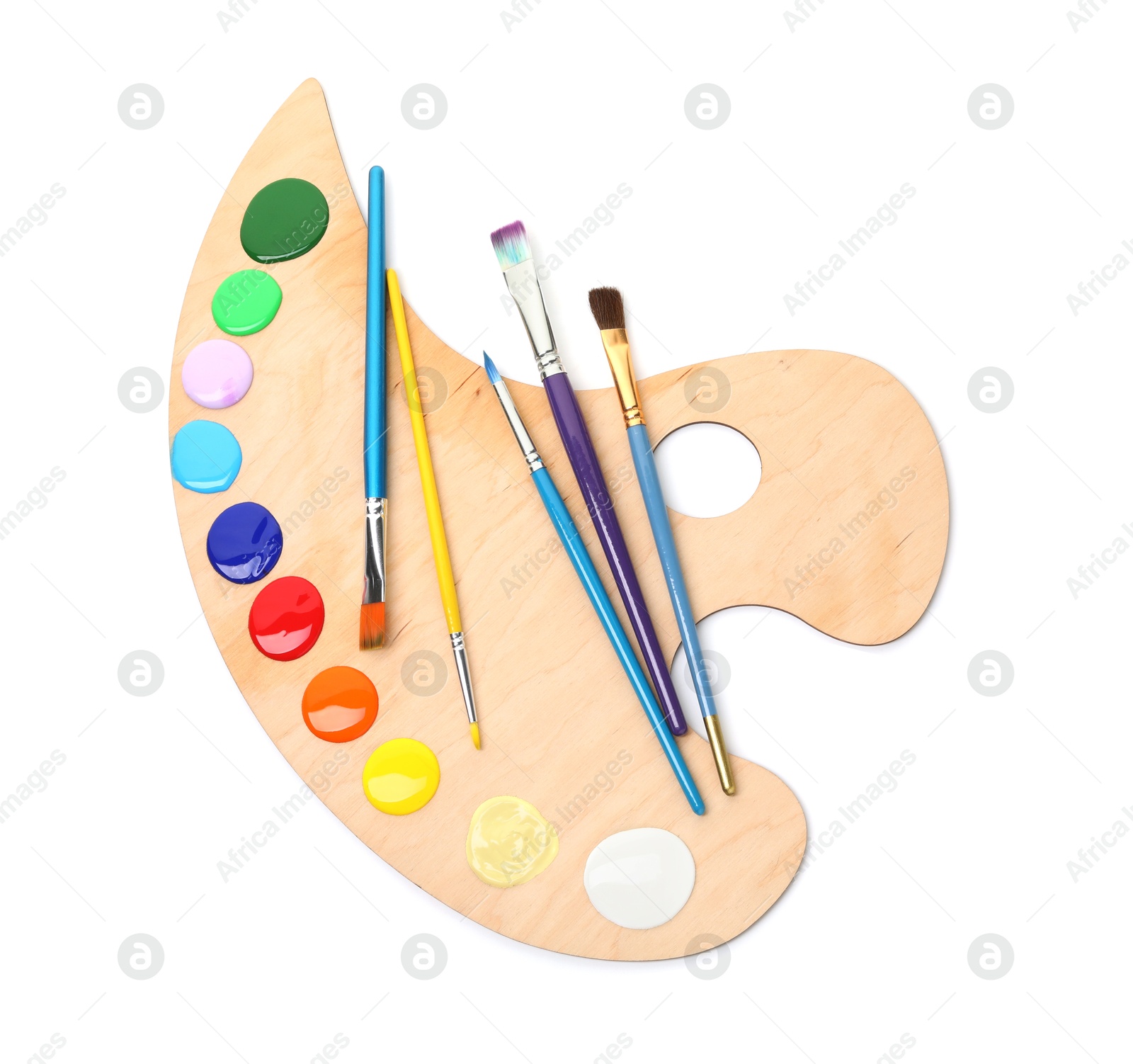Photo of Wooden palette with paints and brushes isolated on white, top view