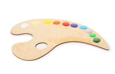 Photo of Wooden palette with paints isolated on white