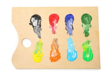 Photo of Wooden palette with paints isolated on white, top view