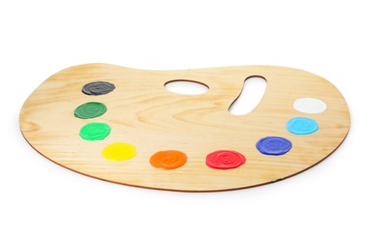 Photo of Wooden palette with paints isolated on white