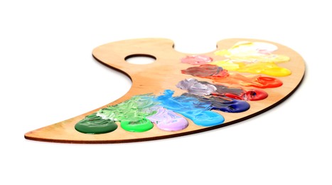 Photo of Wooden palette with paints isolated on white