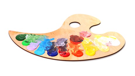 Photo of Wooden palette with paints isolated on white