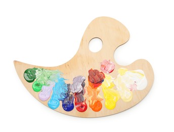 Photo of Wooden palette with paints isolated on white, top view