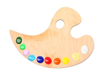 Photo of Wooden palette with paints isolated on white, top view
