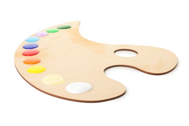 Photo of Wooden palette with paints isolated on white