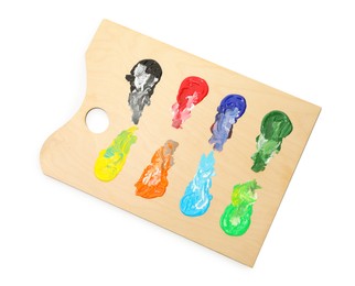 Photo of Wooden palette with paints isolated on white, top view