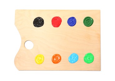 Photo of Wooden palette with paints isolated on white, top view