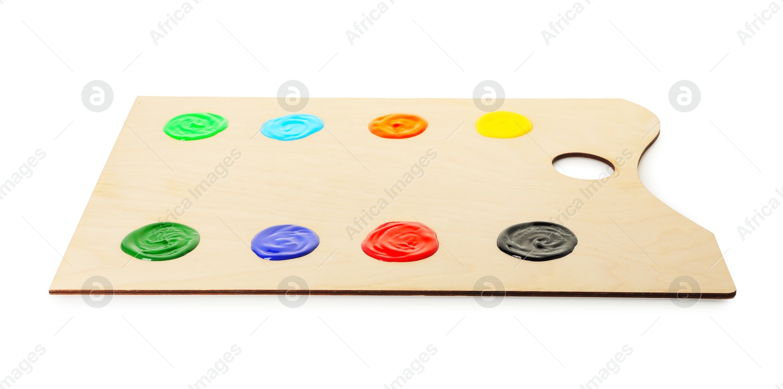 Photo of Wooden palette with paints isolated on white