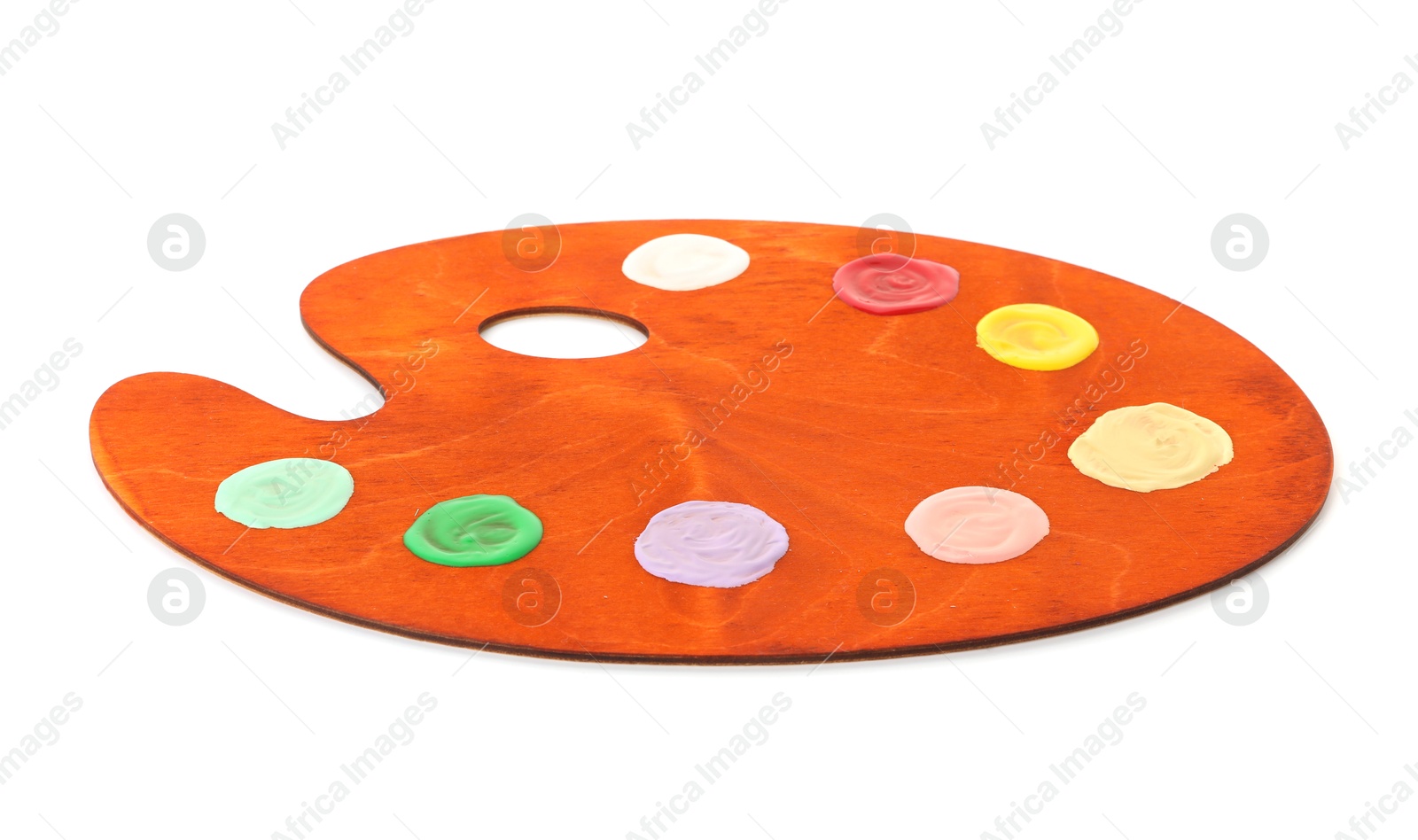 Photo of Wooden palette with paints isolated on white