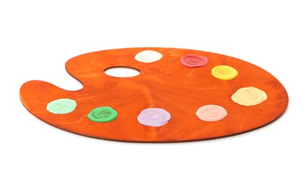 Photo of Wooden palette with paints isolated on white