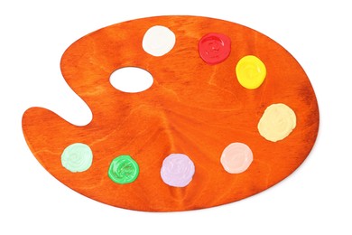Photo of Wooden palette with paints isolated on white, top view