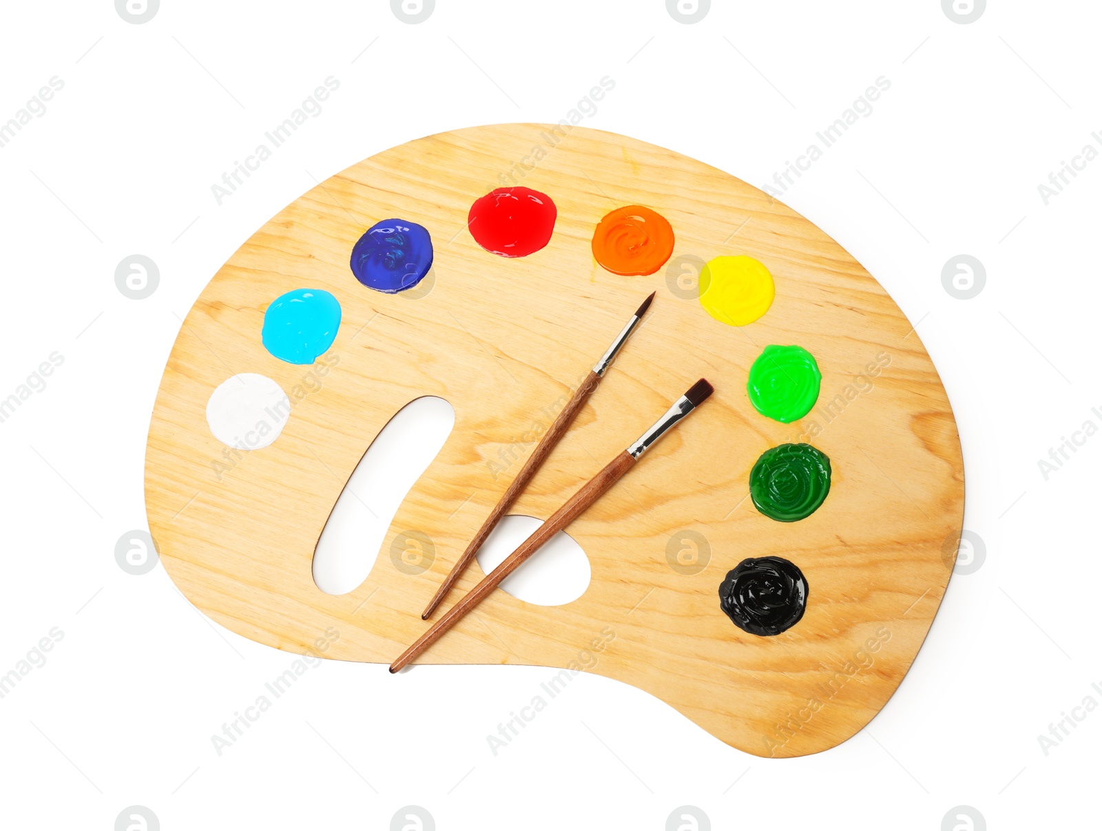 Wooden palette with paints and brushes isolated on white, top view Photo of Wooden palette with paints and brushes isolated on white, top view