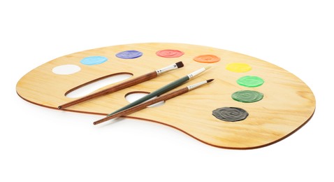 Photo of Wooden palette with paints and brushes isolated on white