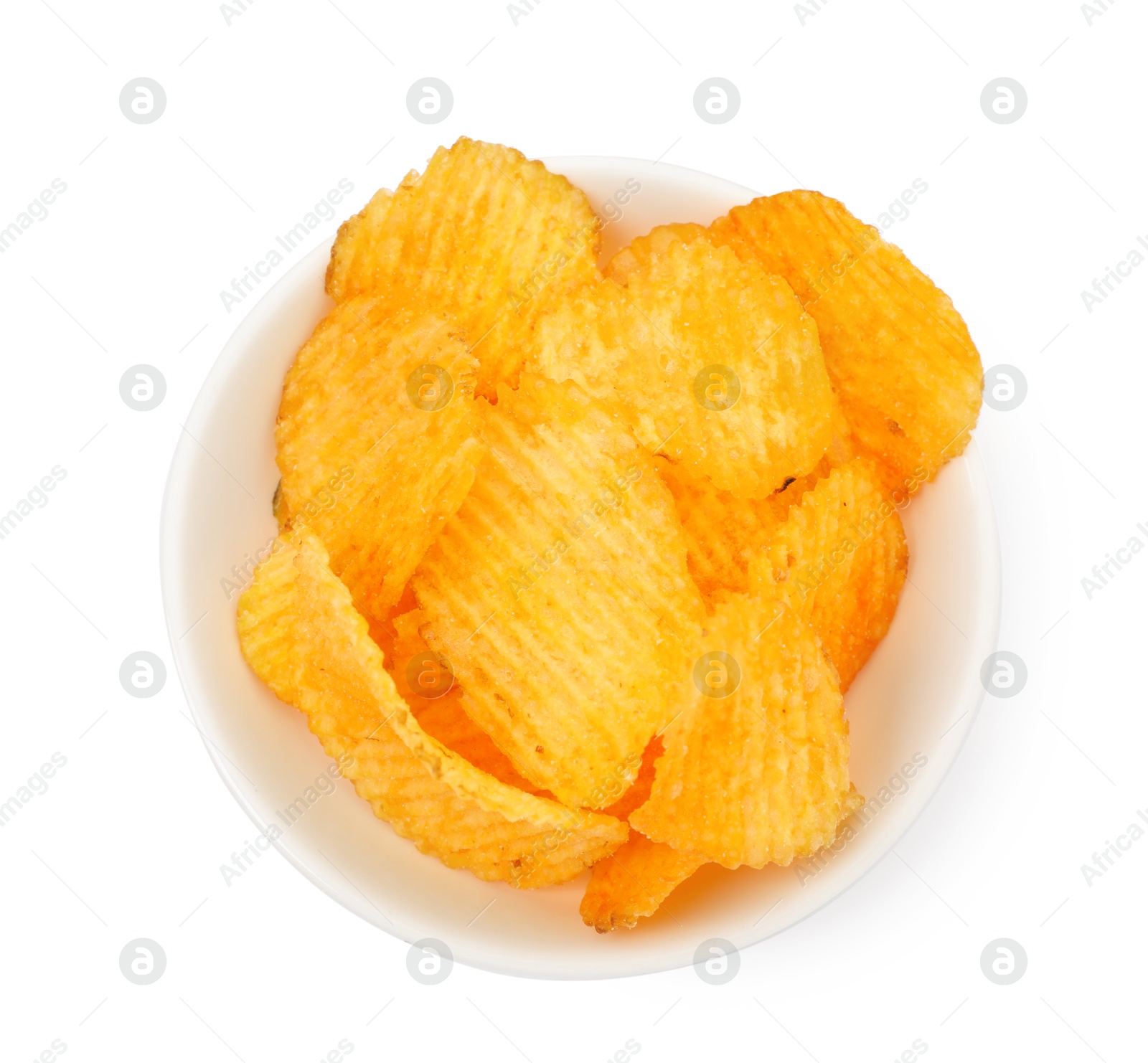 Tasty ridged chips in bowl isolated on white, top view Photo of Tasty ridged chips in bowl isolated on white, top view