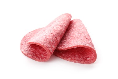 Photo of Slices of tasty smoked sausage isolated on white