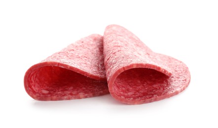 Photo of Slices of tasty smoked sausage isolated on white