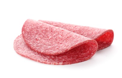 Photo of Slices of tasty smoked sausage isolated on white