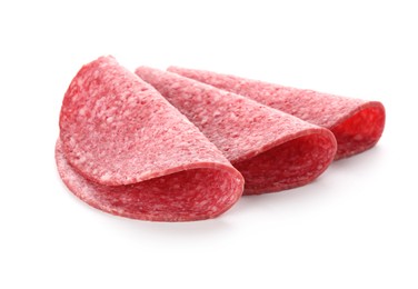 Photo of Slices of tasty smoked sausage isolated on white