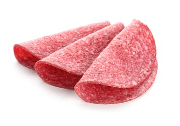 Photo of Slices of tasty smoked sausage isolated on white