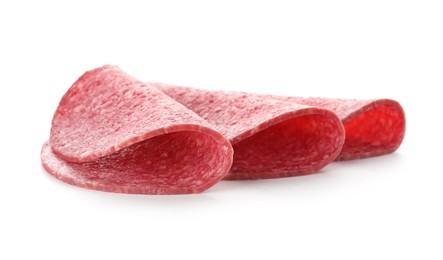 Photo of Slices of tasty smoked sausage isolated on white