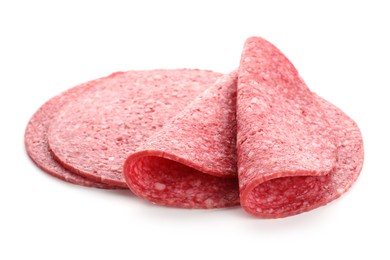 Photo of Slices of tasty smoked sausage isolated on white