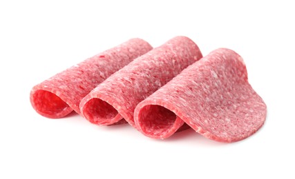 Photo of Slices of tasty smoked sausage isolated on white
