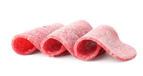 Photo of Slices of tasty smoked sausage isolated on white